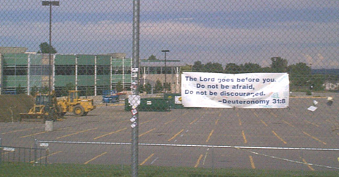 Supportive banner on Columbine High fence during construction