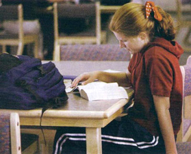A student studies in Columbine's new HOPE library
