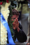A student cries at the memorial
